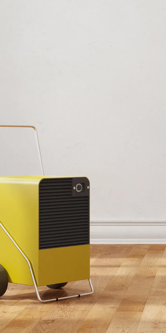 Gelber Luftentfeuchter auf Holzboden in einem Raum mit feuchten Wänden