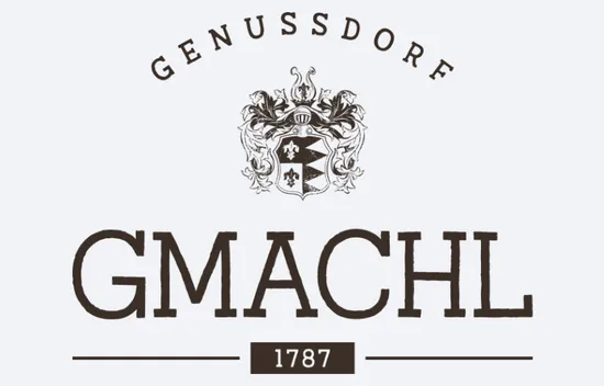 Gmachl Genussdorf-Logo mit verziertem Wappen und Inschrift 1787