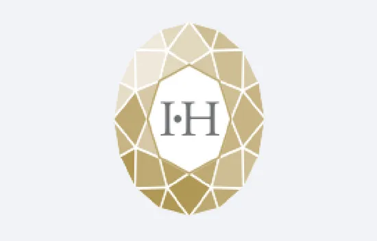 Goldenes geometrisches Muster mit den Buchstaben I.H in der Mitte
